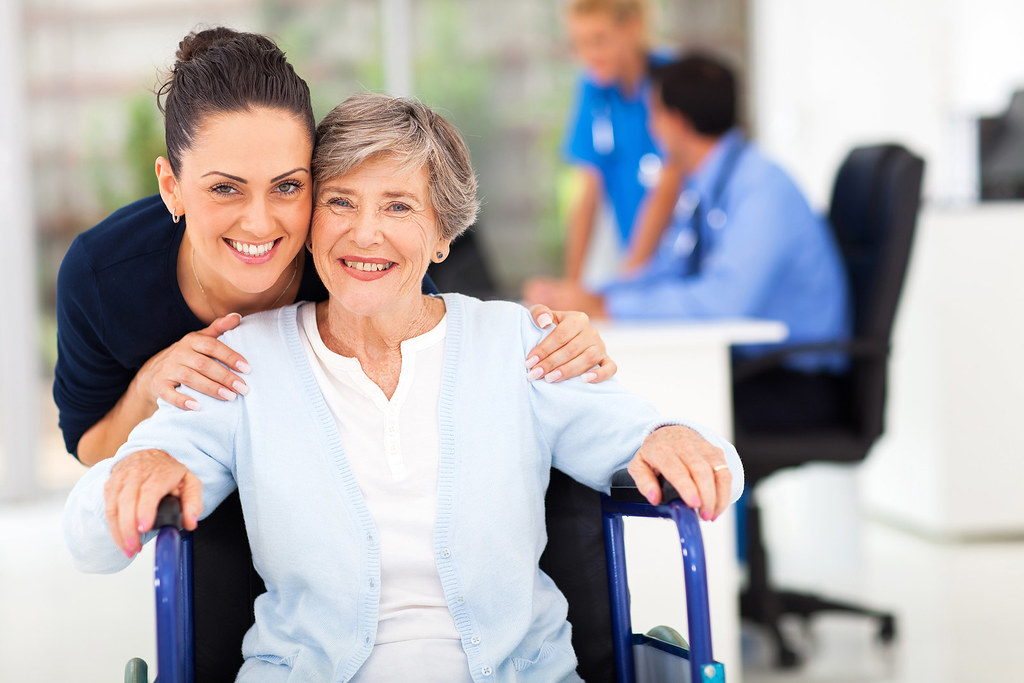 Adult daughter caring for and accompanying her senior mother
