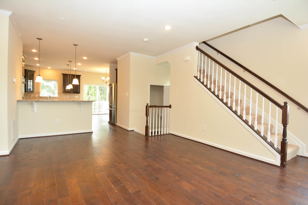 Empty living room in a new construction townhome staged for listing
